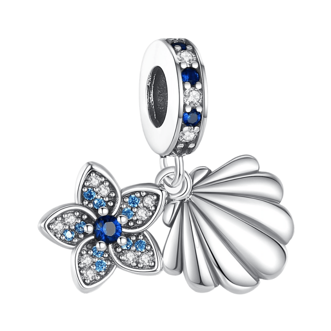 Sparkling Flower And Shell Dangle Charm featuring a blue flower and a shell in a delicate silver design.