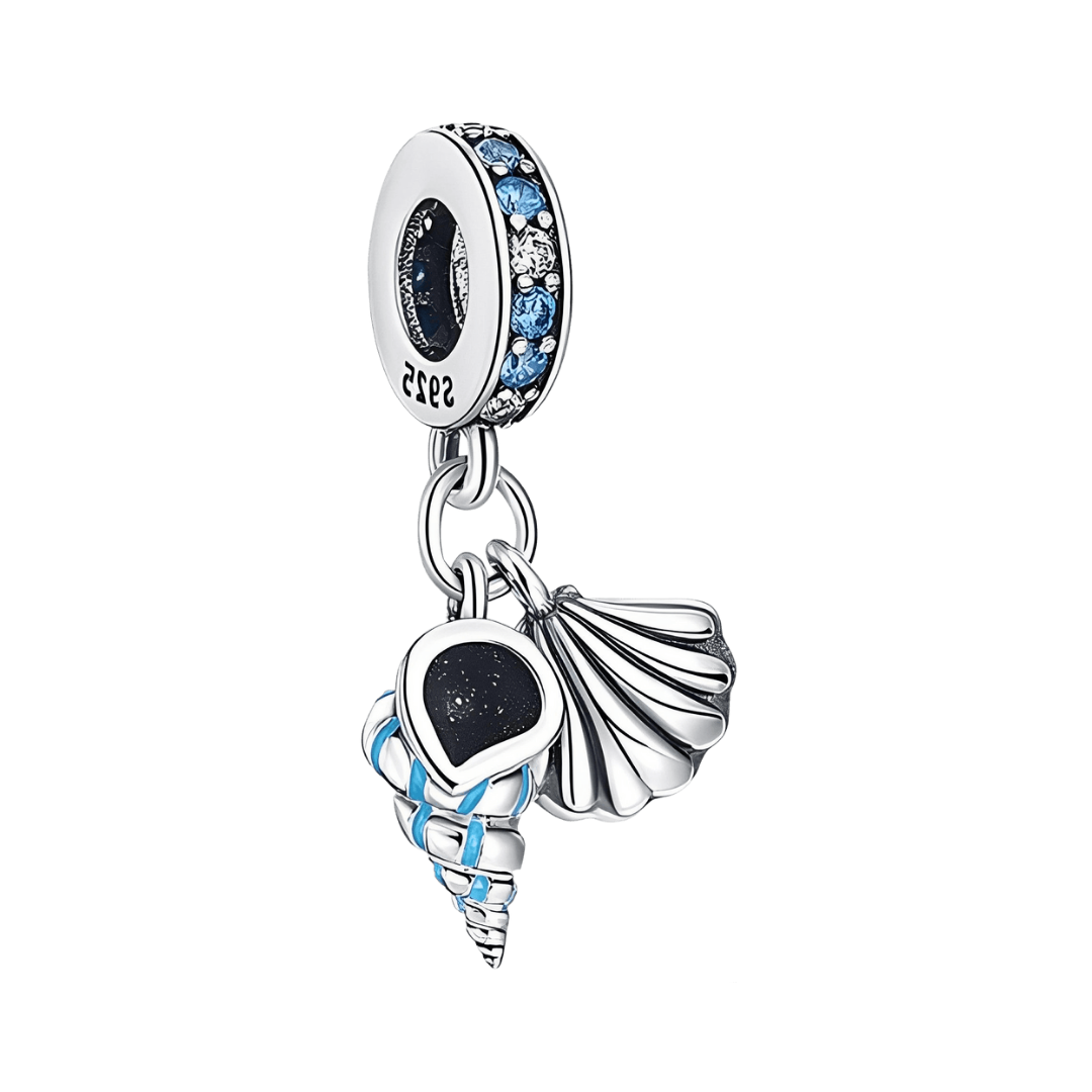 Sparkling Ocean Shell Duo Dangle Charm featuring scallop and spiral conch shells adorned with blue enamel.