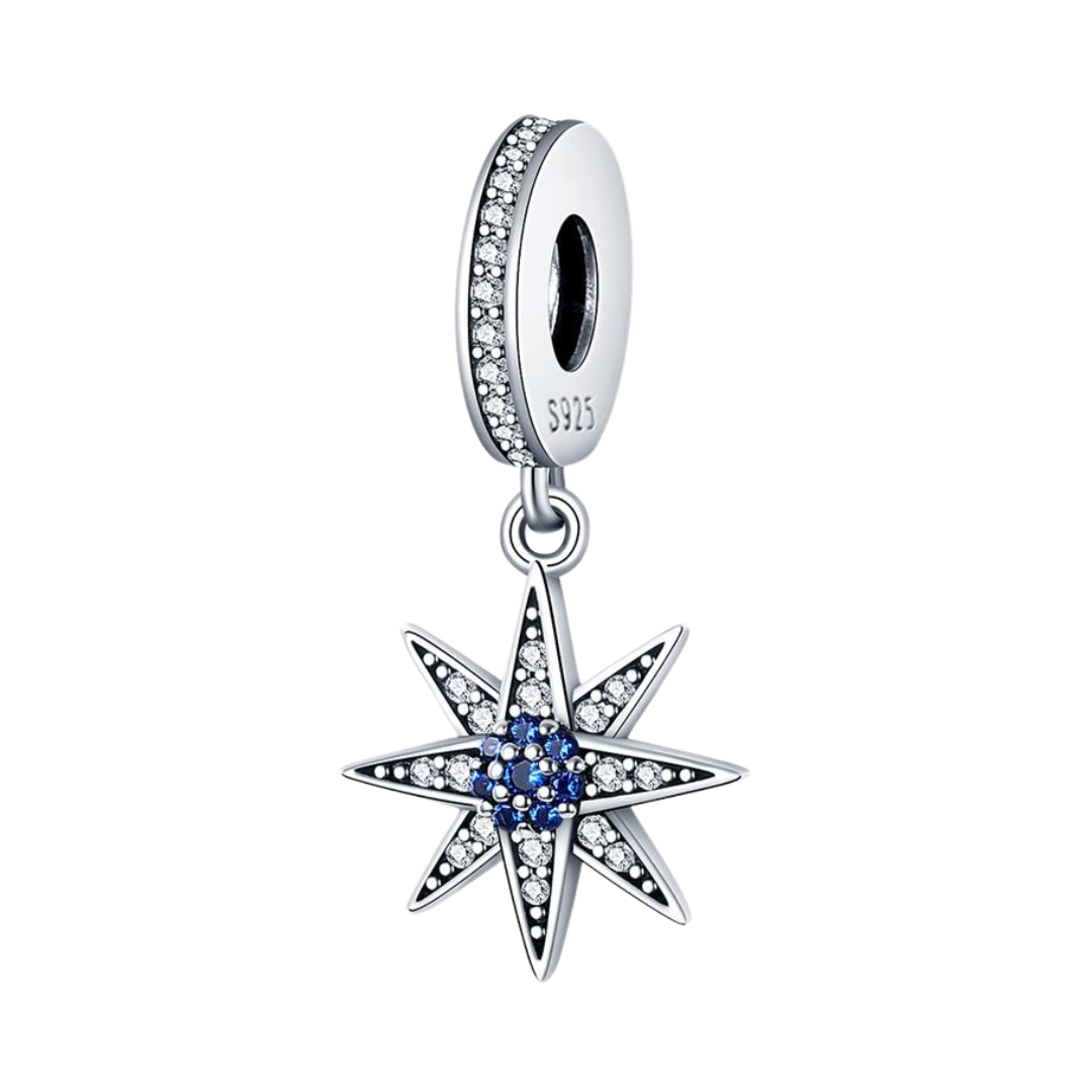 Wish Upon a North Star Dangle Charm ( Discontinued ) featuring a sparkling star design with blue center and white stones.