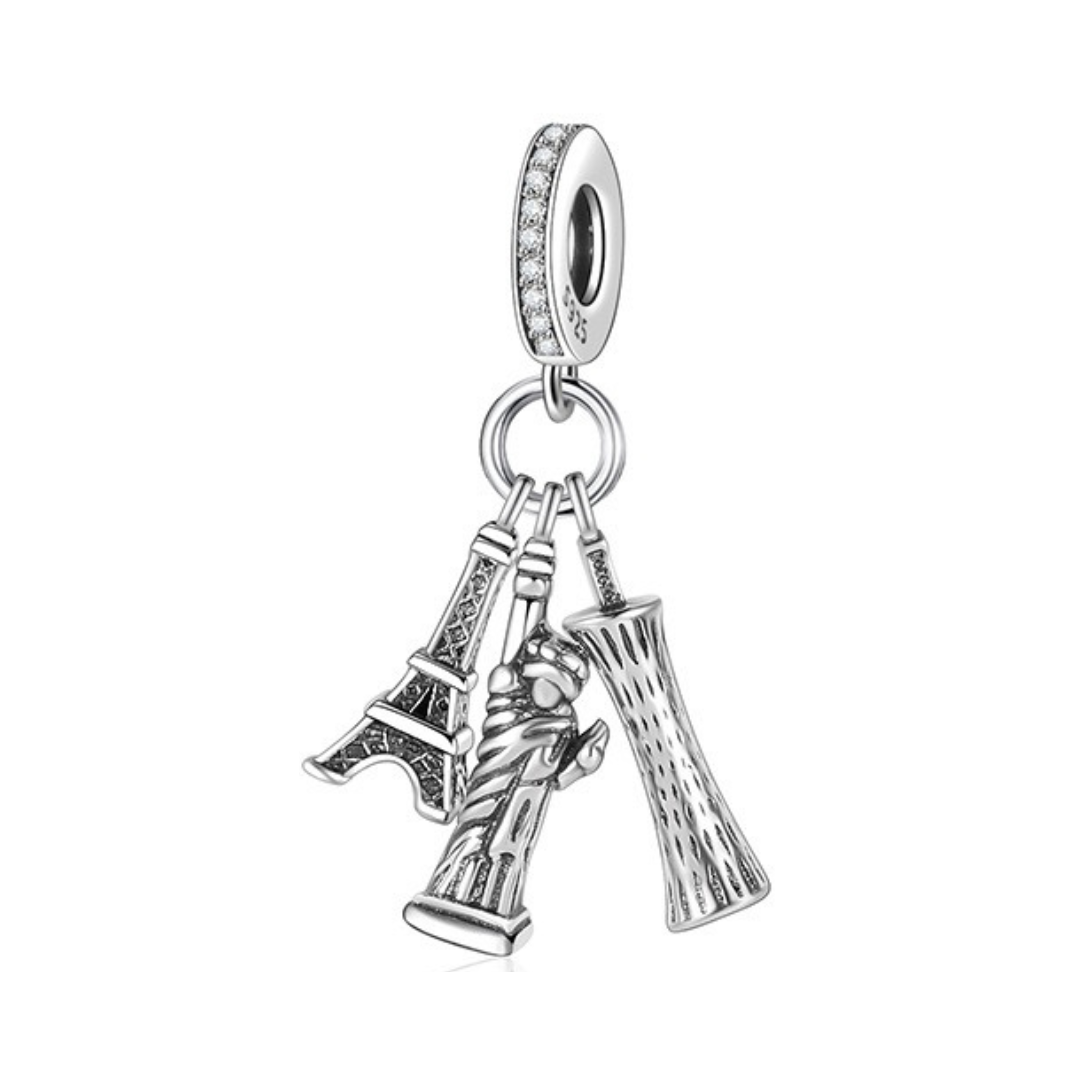 World Landmarks Travel Triple Dangle Charm featuring Eiffel Tower, Statue of Liberty, and Leaning Tower of Pisa.