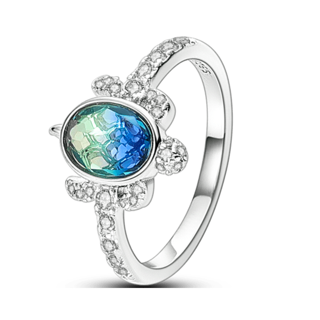 Zircon Turtle Ring (DISCONTINUED) featuring a blue and green zircon stone surrounded by sparkling accents.